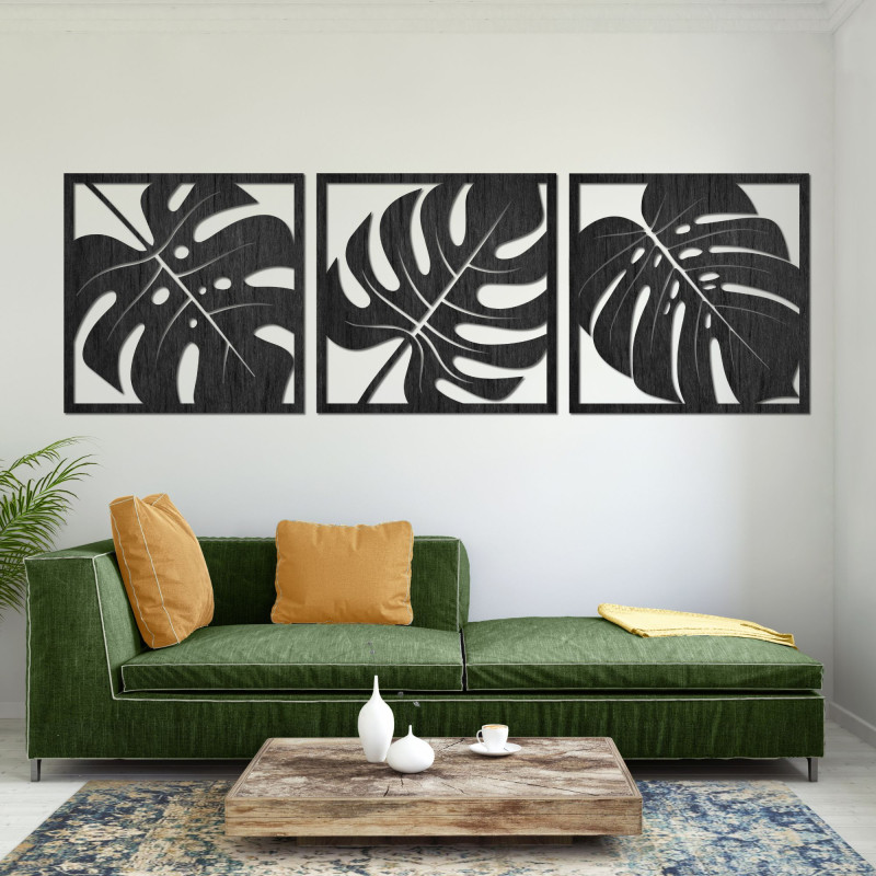 Wanddekoration aus Holz mit Monstera-Blattmotiv. Tropische Wandbilder aus Holz mit Monstera-Blattmotiv.