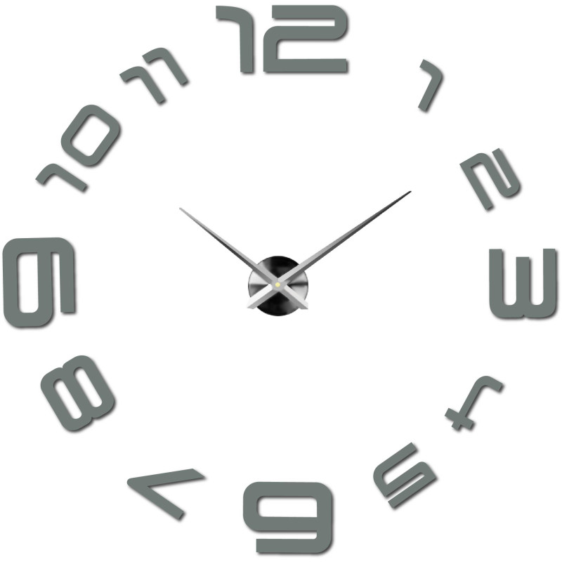 Eine Wanduhr mit großem Zifferblatt, bei der die Zahlen direkt auf die Wand geklebt sind.