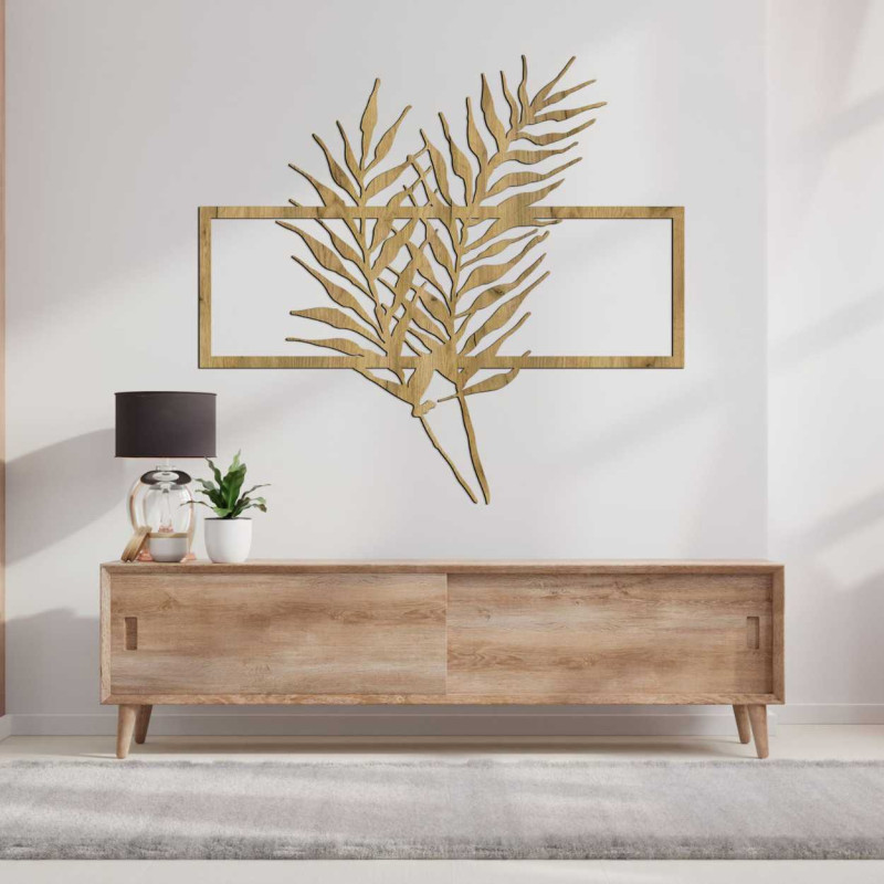 Wanddekoration aus Holz mit tropischen Blättern in einem modernen Rahmen
