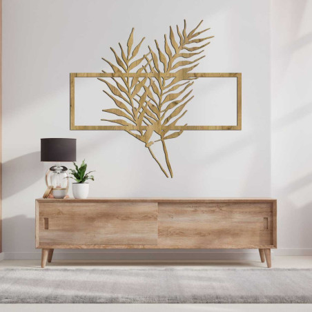 Wanddekoration aus Holz mit tropischen Blättern in einem modernen Rahmen